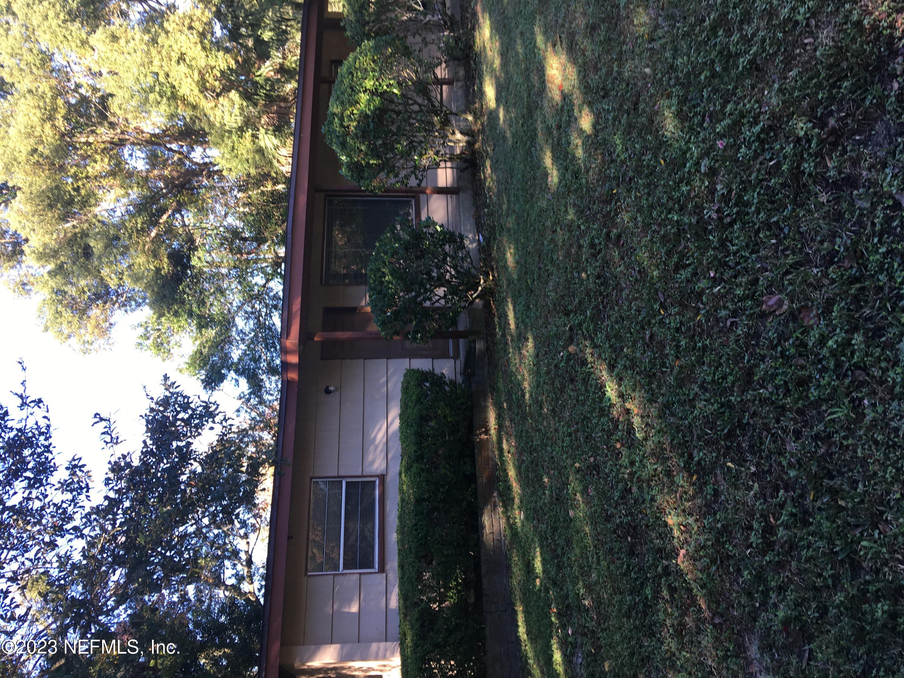 a view of house with yard