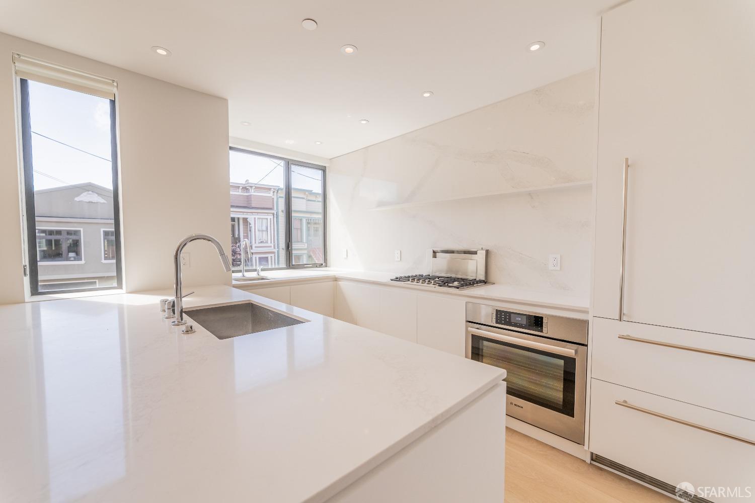 a kitchen with a stove and a sink