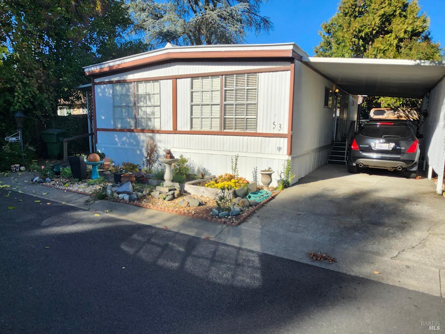 a front view of a house with outdoor space