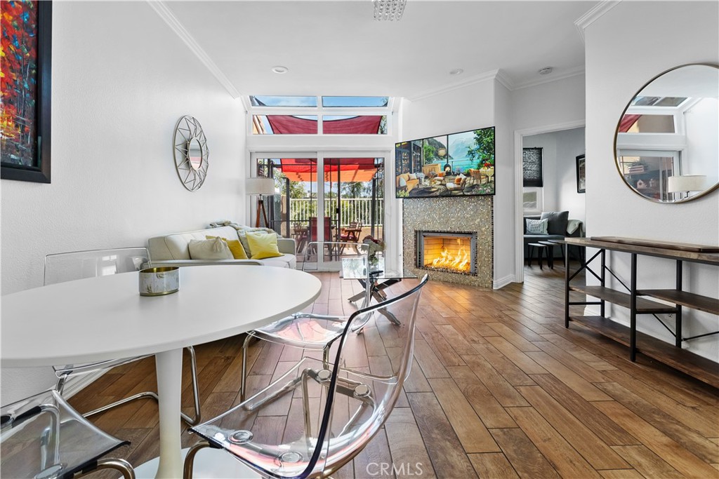 a living room with fireplace furniture and a wooden floor