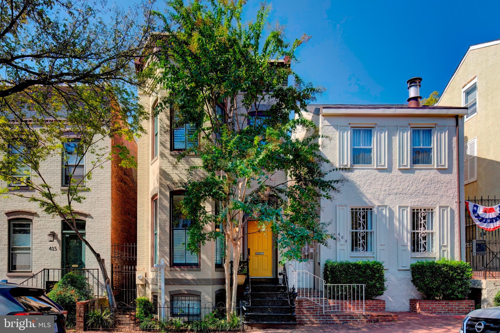 a house that has a tree in front of it