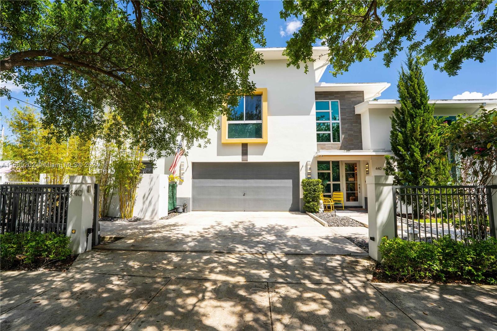 front view of a house with a tree