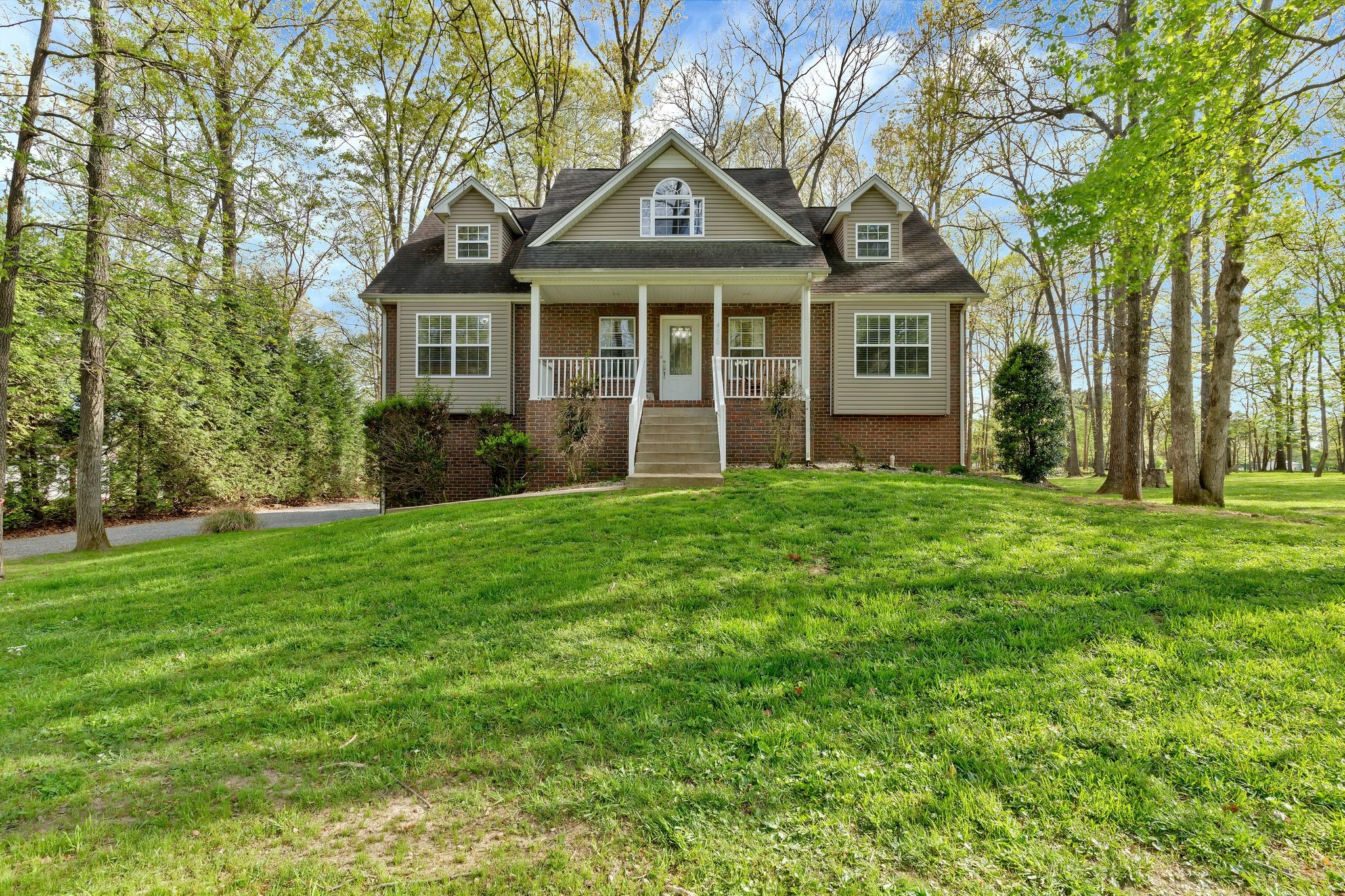 a front view of a house with a yard