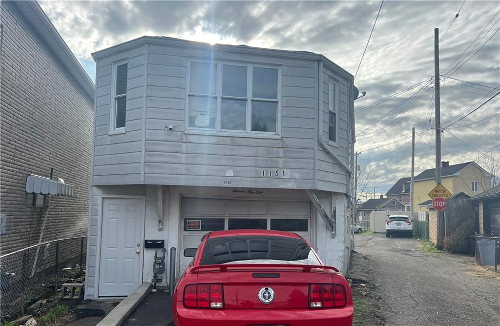 a front view of a house with parking