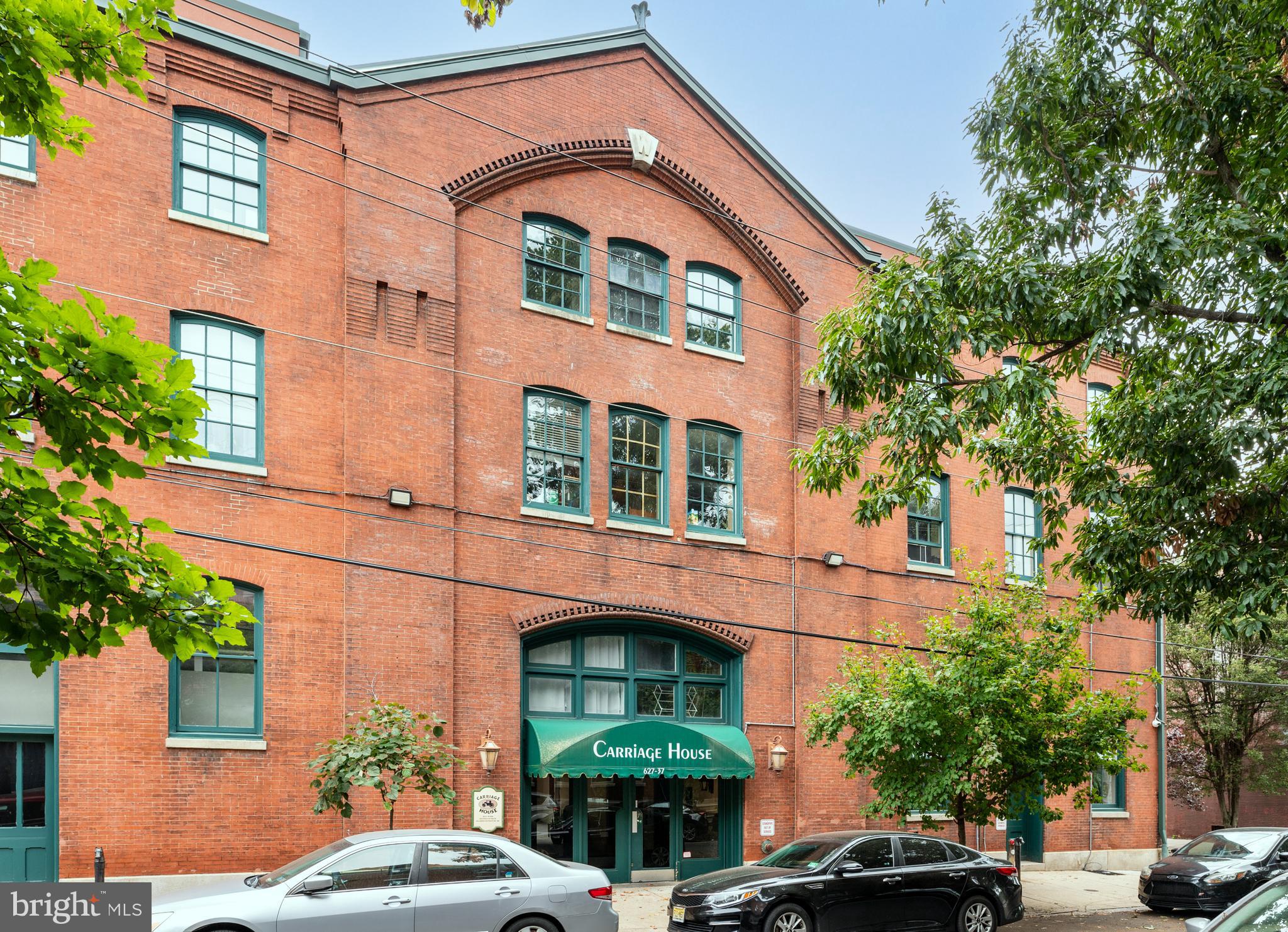 a front view of a building with garden