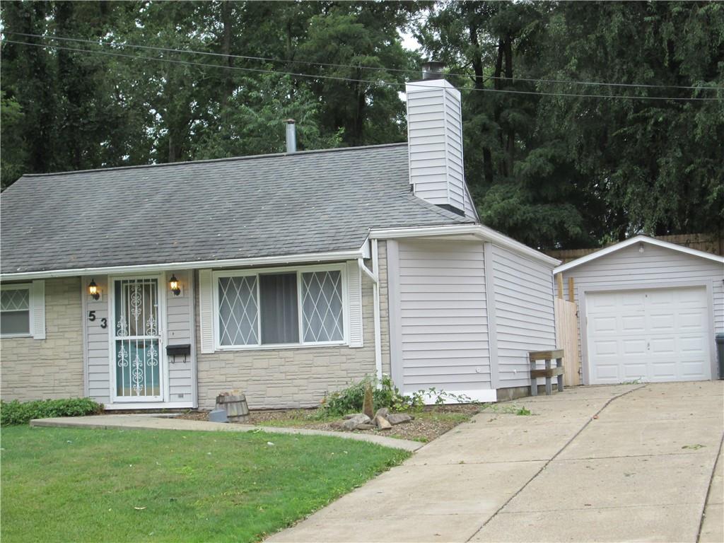 a view of a house with a yard and plants