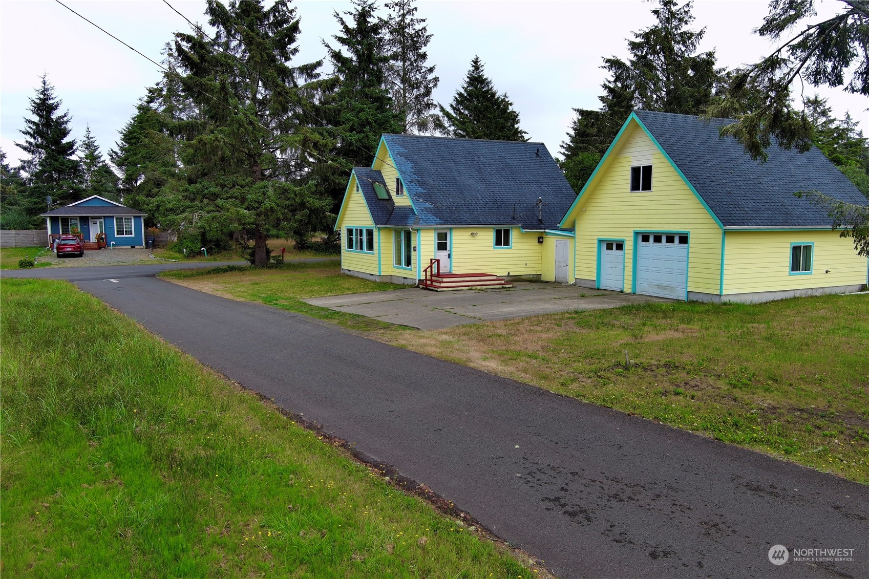 a front view of house with yard and green space