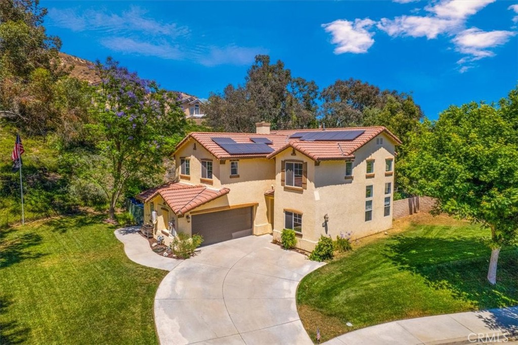 a aerial view of a house with a big yard