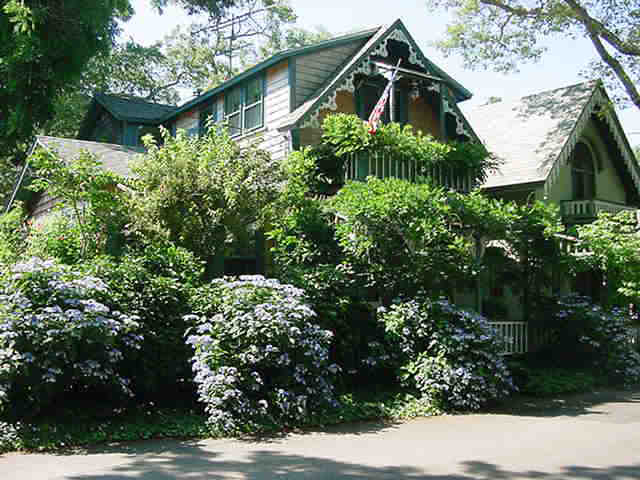 an outdoor view of house with green space