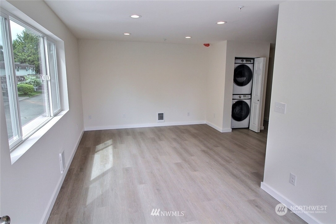 a view of a storage & utility room with a window