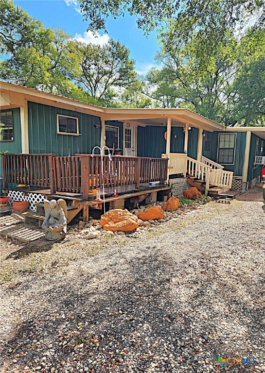 a backyard of a house with wooden fence