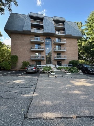 a front view of a house with parking area