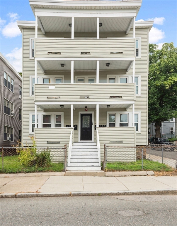 a view of a house with a parking space