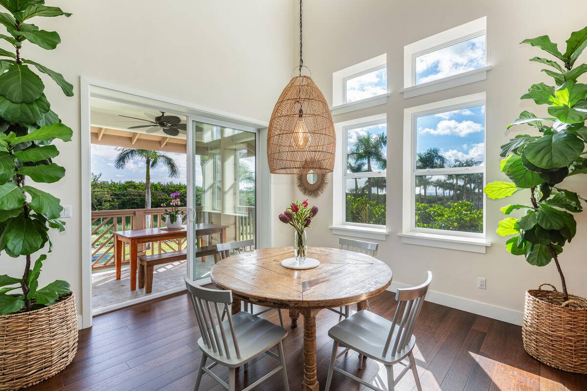 a dining room with furniture window and wooden floor