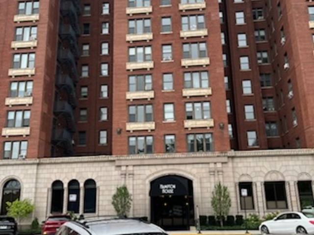 a front view of a building with glass windows