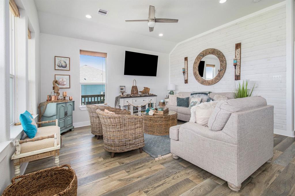 a living room with fireplace furniture and a flat screen tv