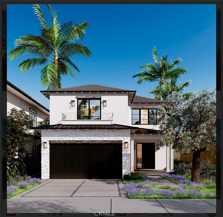 a front view of a house with garage and a yard