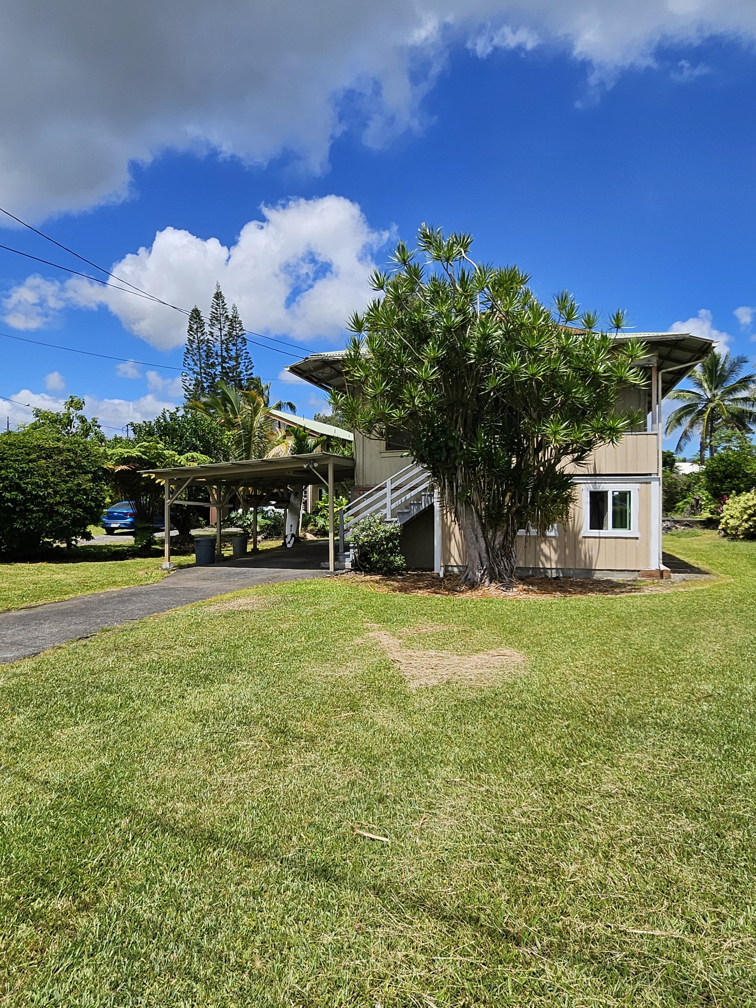 Front of the home has a welcoming grassy front lawn. Quiet street in a centrally located neighborhood.