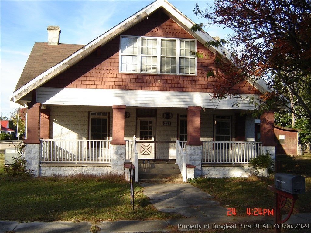 a front view of a house with a porch