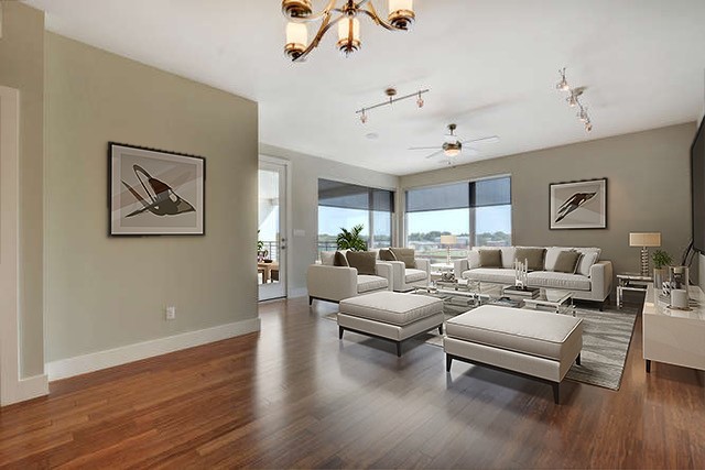 a living room with furniture or couch and a ceiling fan