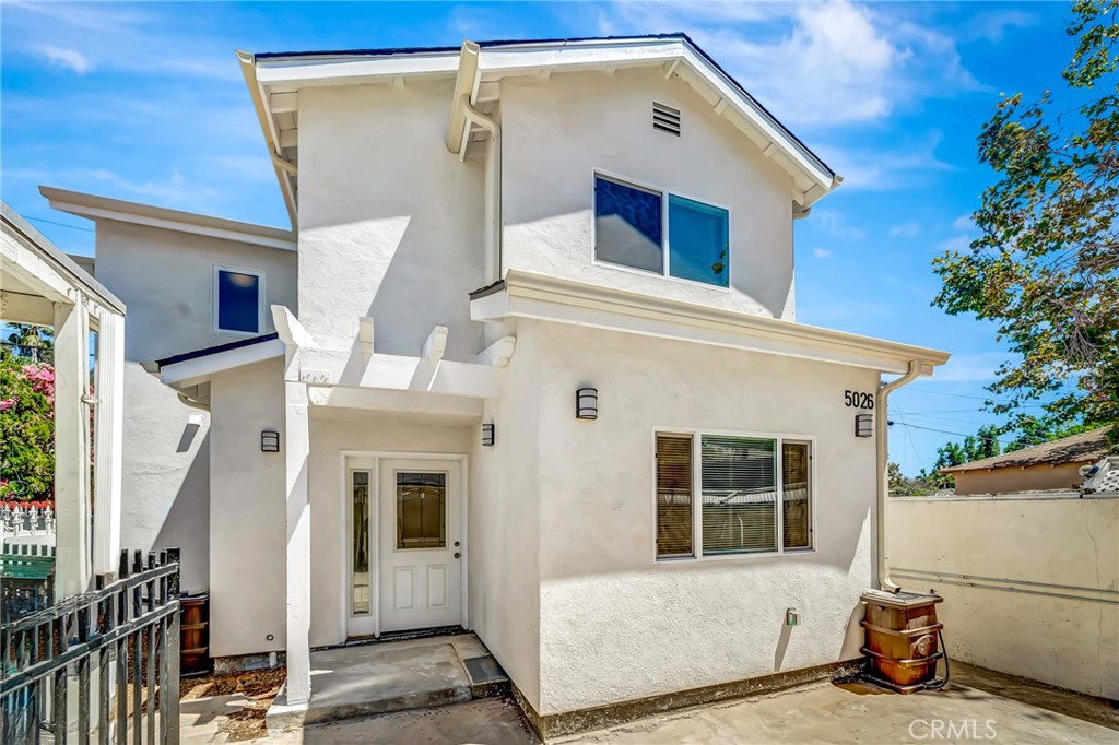 a front view of a house with a garage