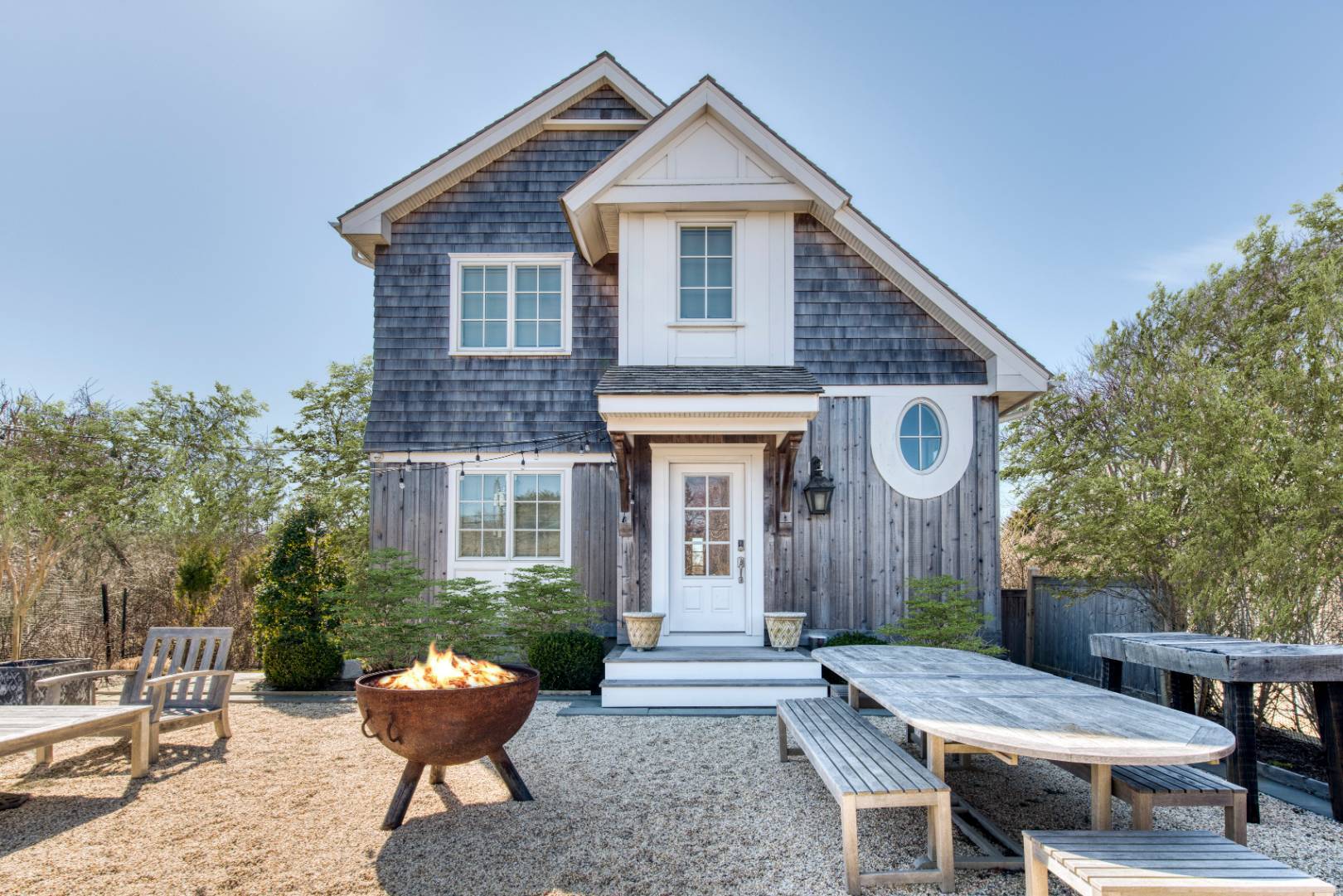 a view of a house with patio and a yard