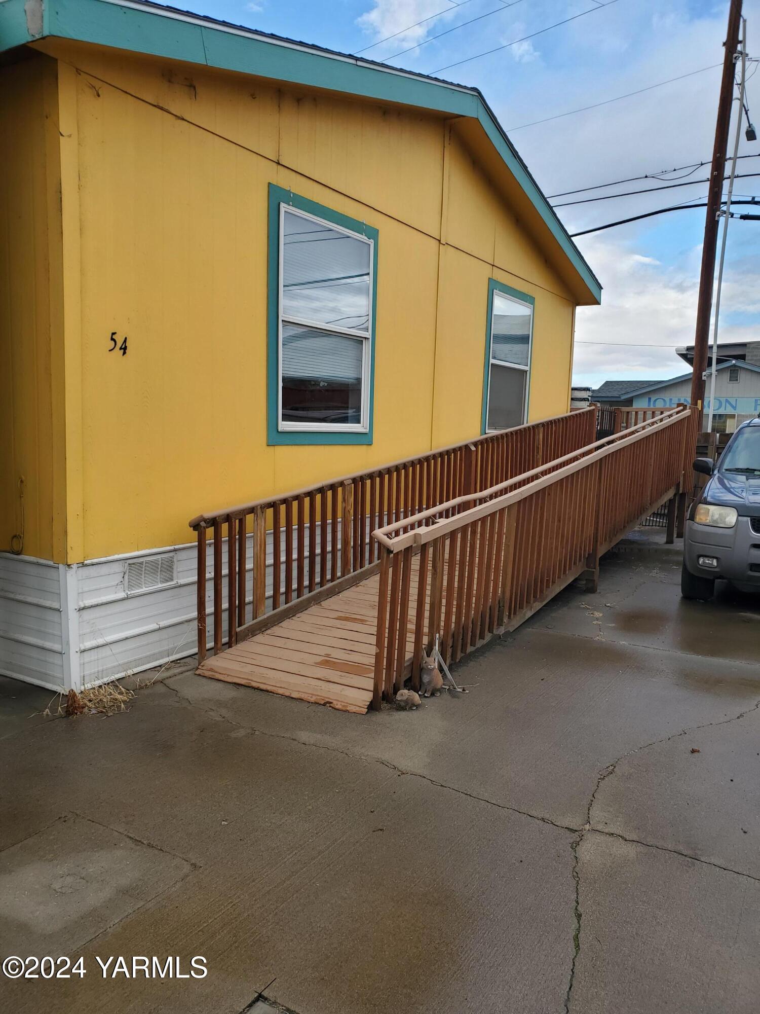 a view of balcony with furniture