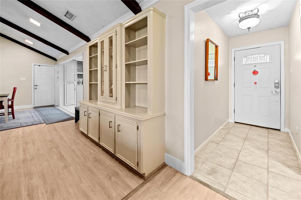 a view of a hallway with entryway wooden floor windows and entryway