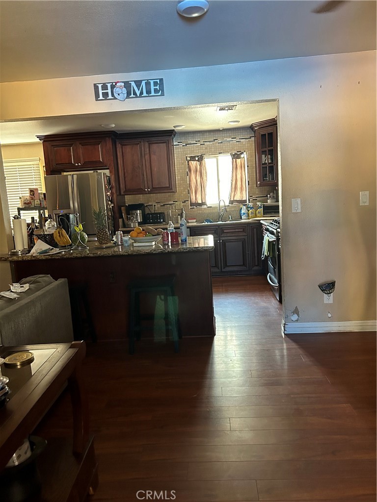 a kitchen with a sink and a stove top oven