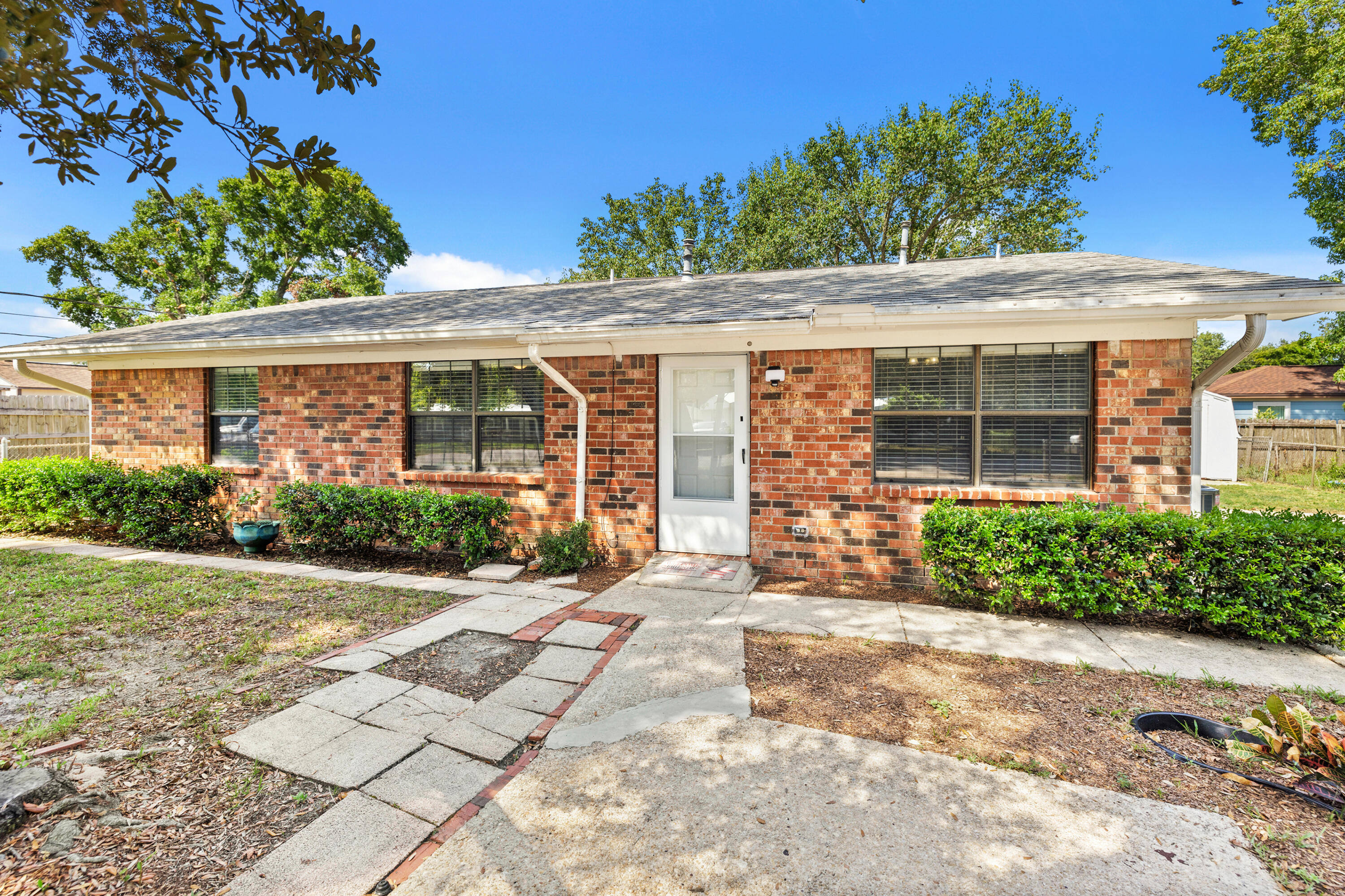 front view of a house with a yard