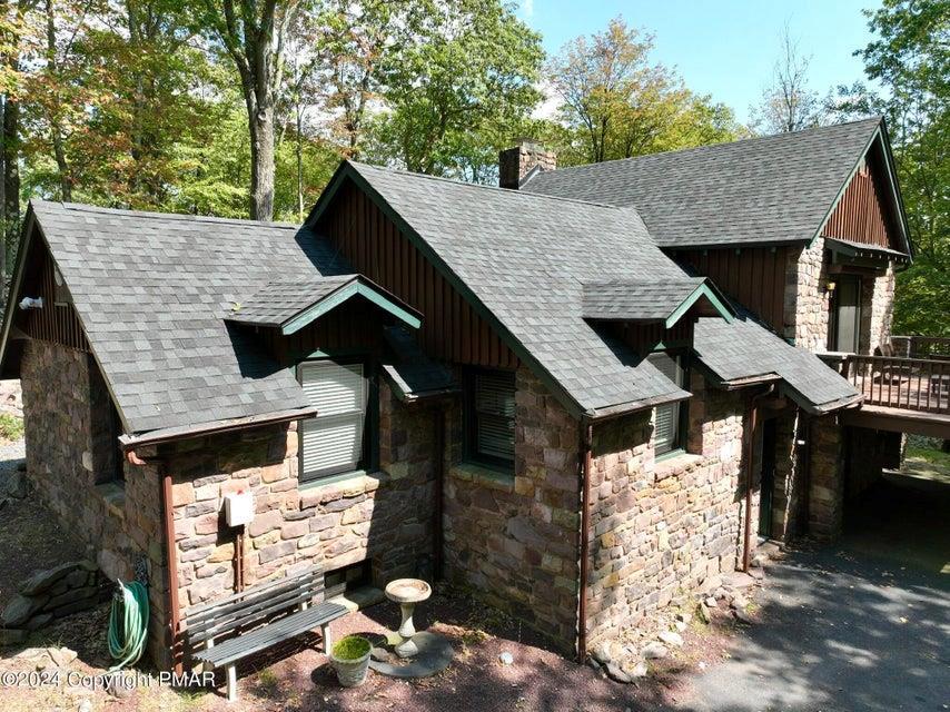 a aerial view of a house with a yard