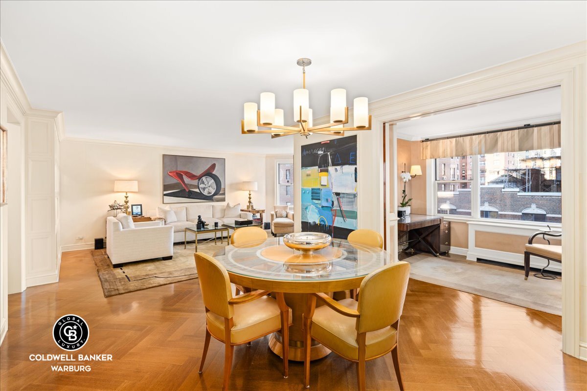 a dining room with a table and chairs