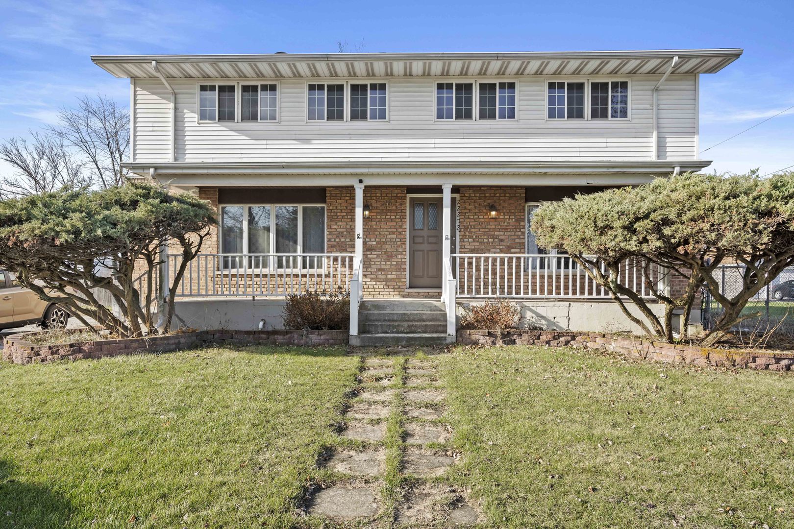 a front view of a house with a yard