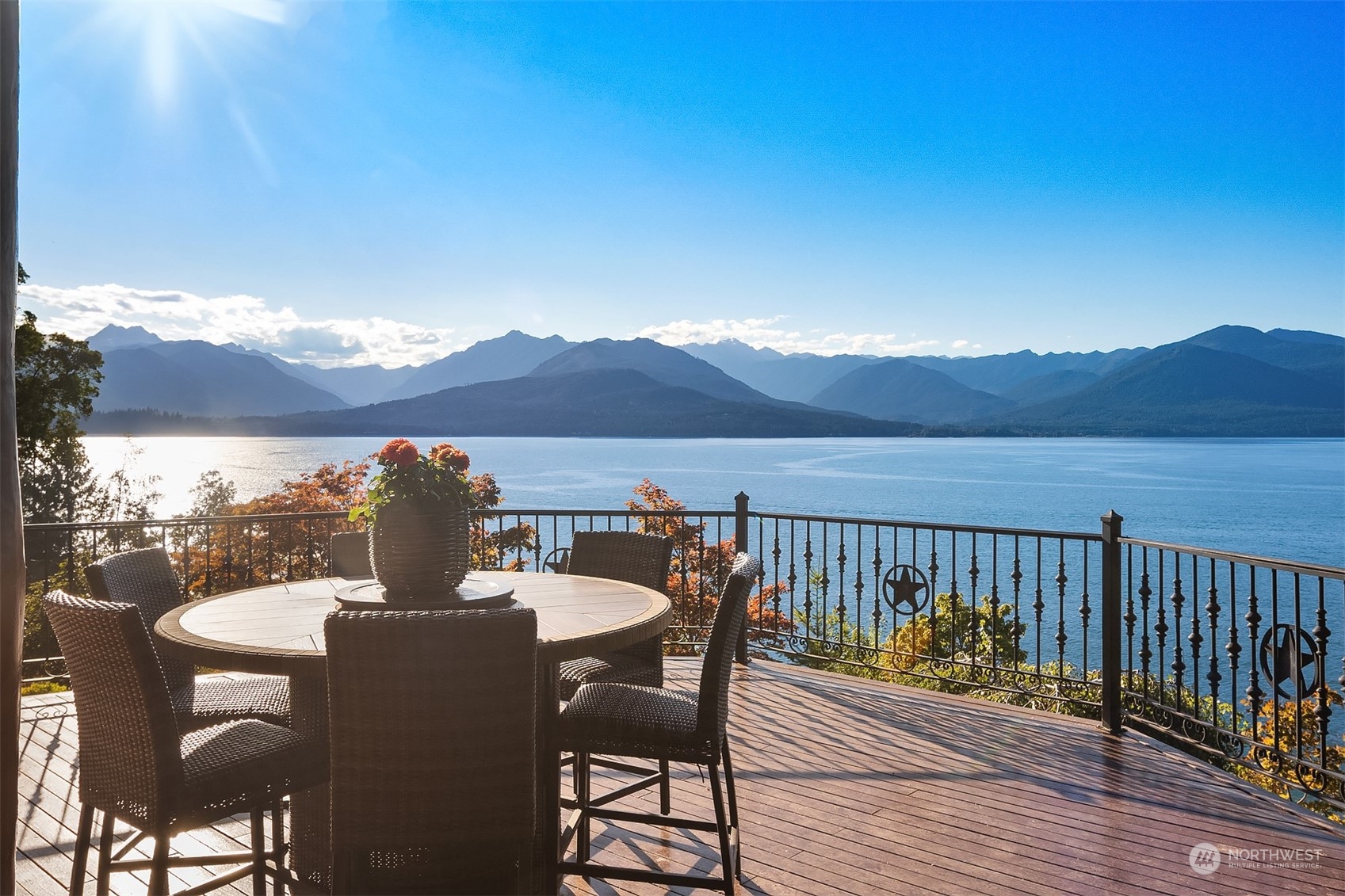 a view of a chairs and table on the deck