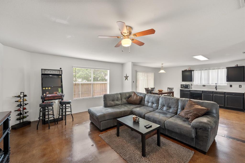 a living room with furniture and a window