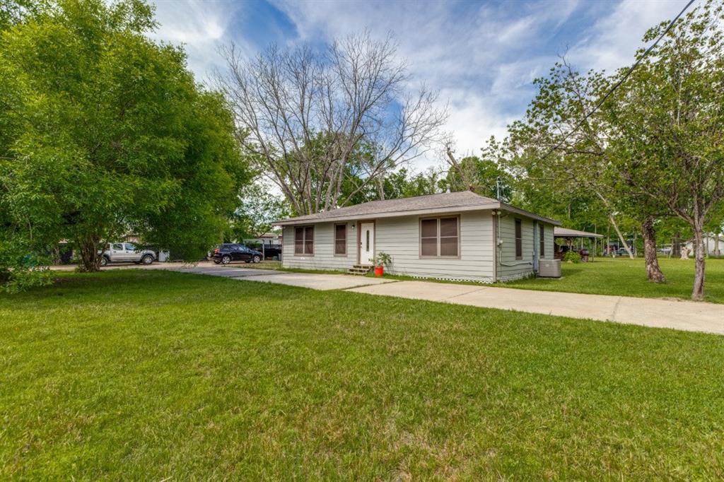 This lovely property could easily be an Air BNB short term rental. Pictured here is the main house (One of three on the property) with the circular driveway.