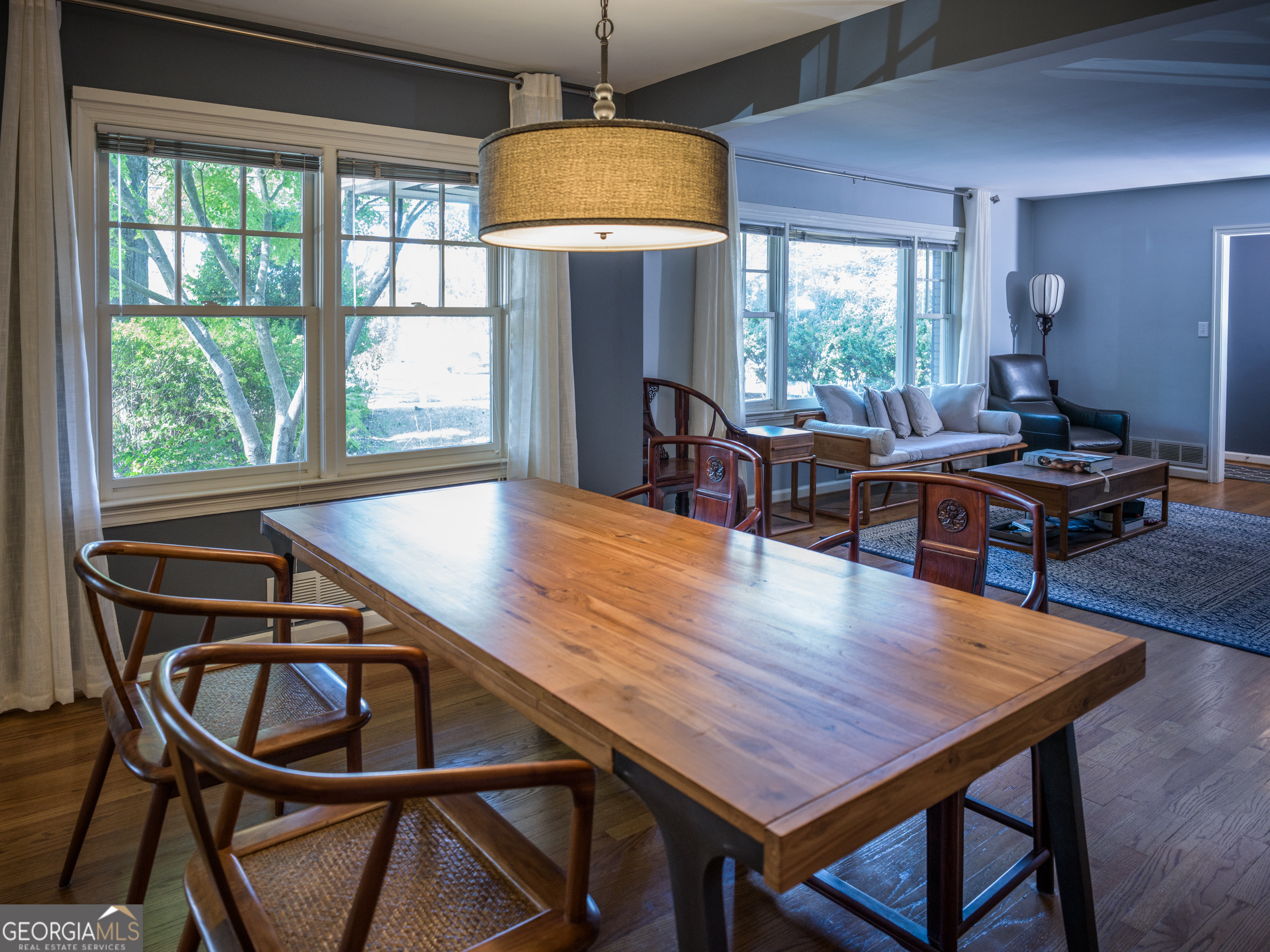 a dining room with furniture and window