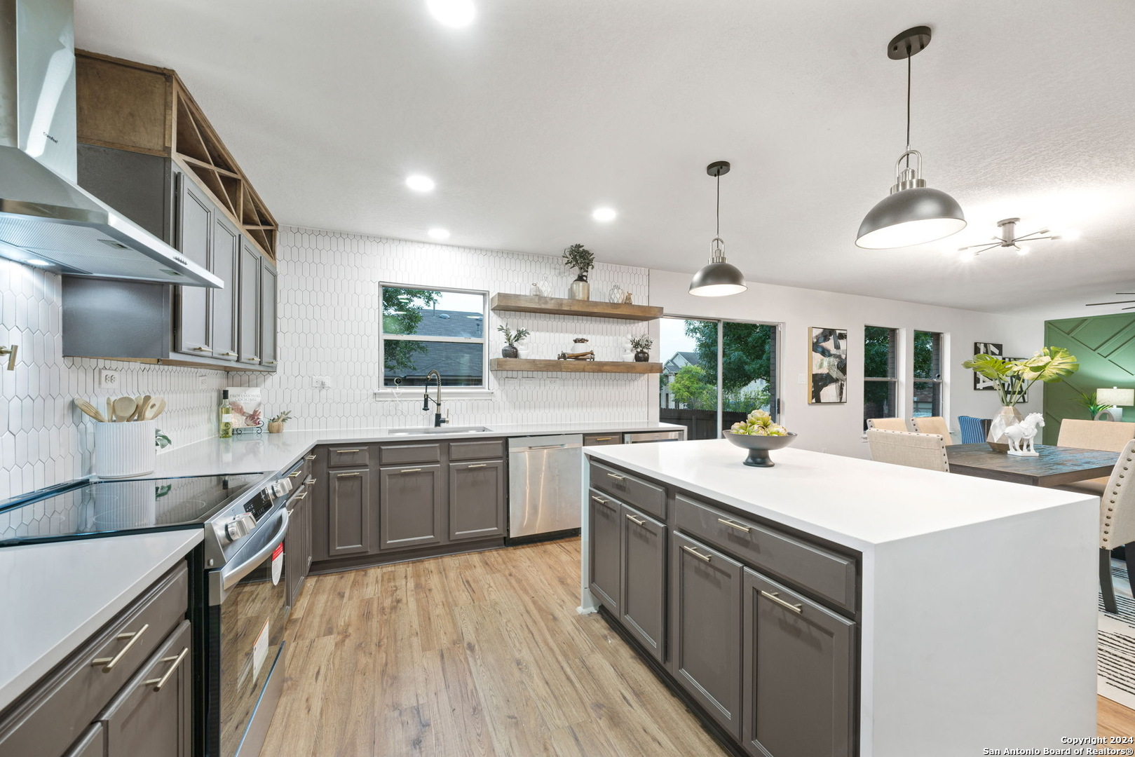 a kitchen with a sink stove and wooden cabinets