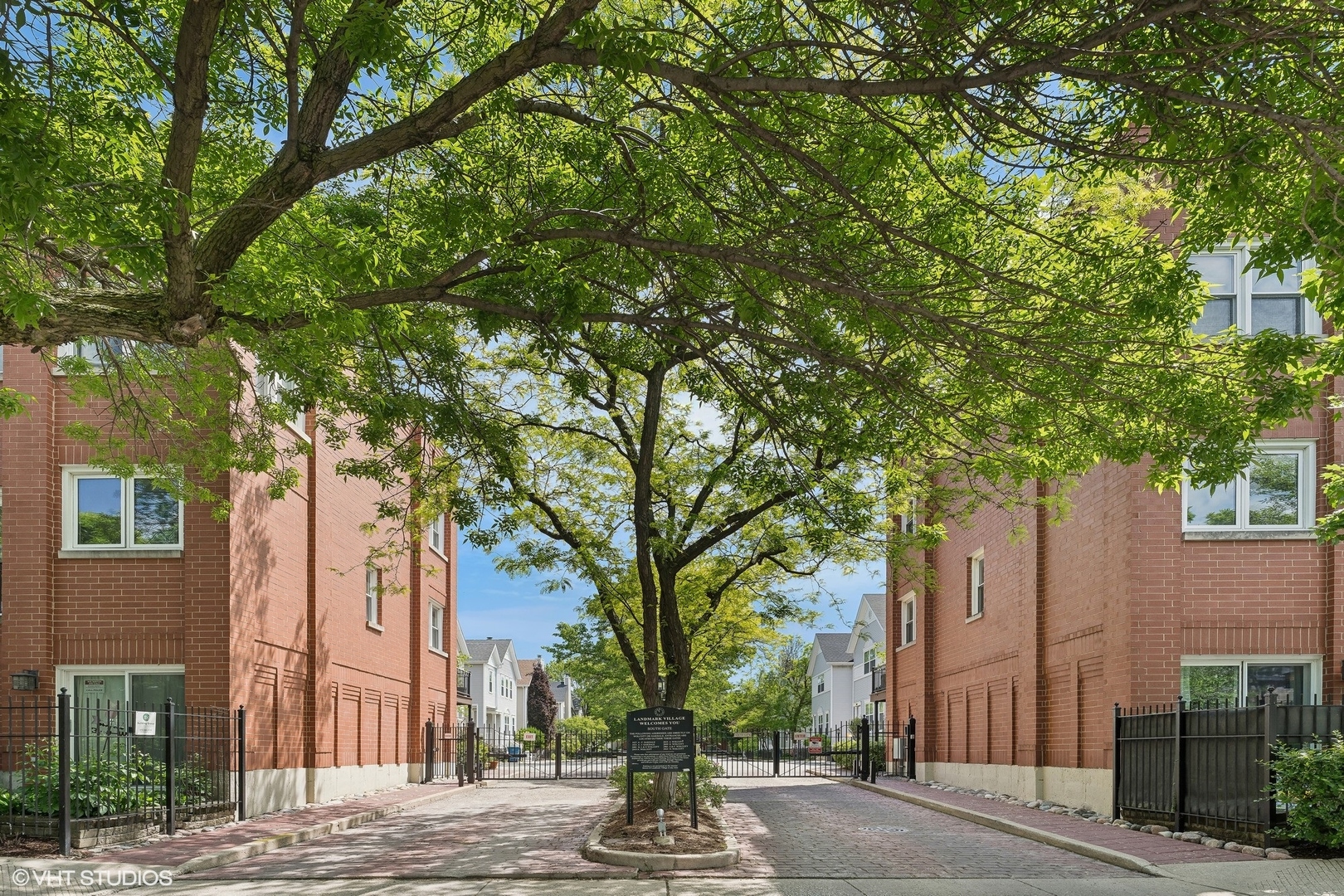 a view of a house with a tree