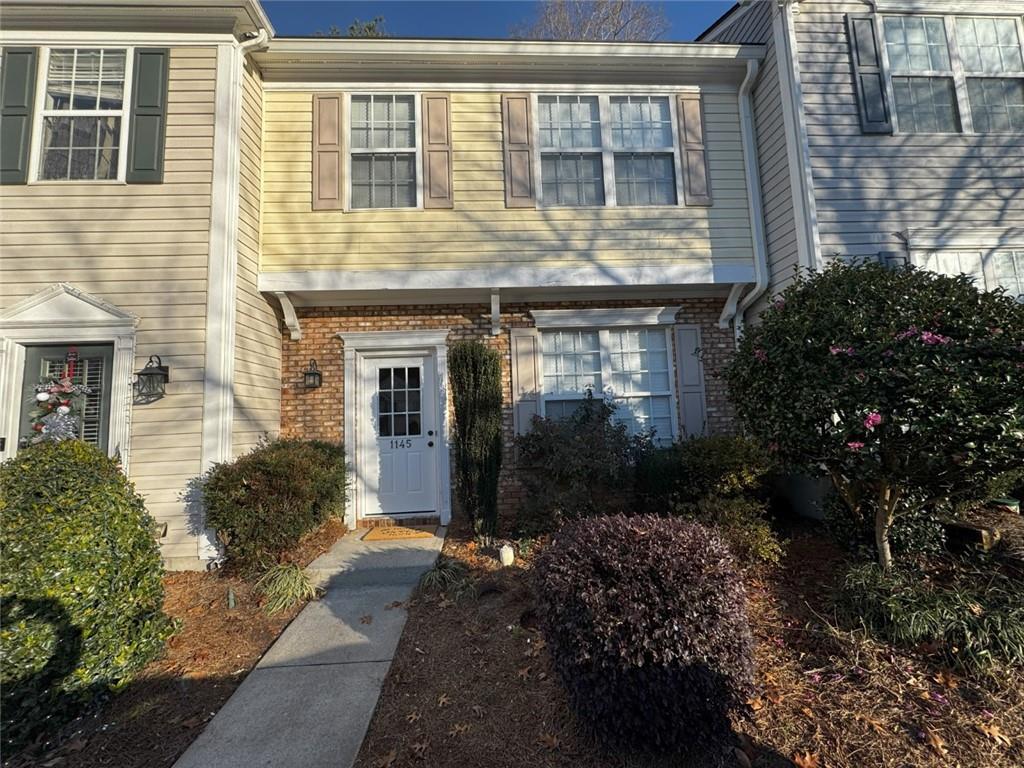 a front view of a house having yard