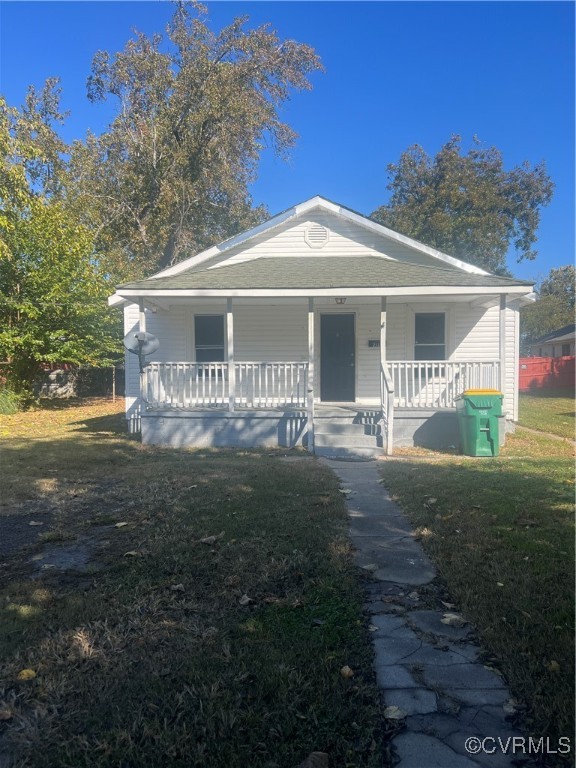 Bungalow-style home featuring covered porch and a