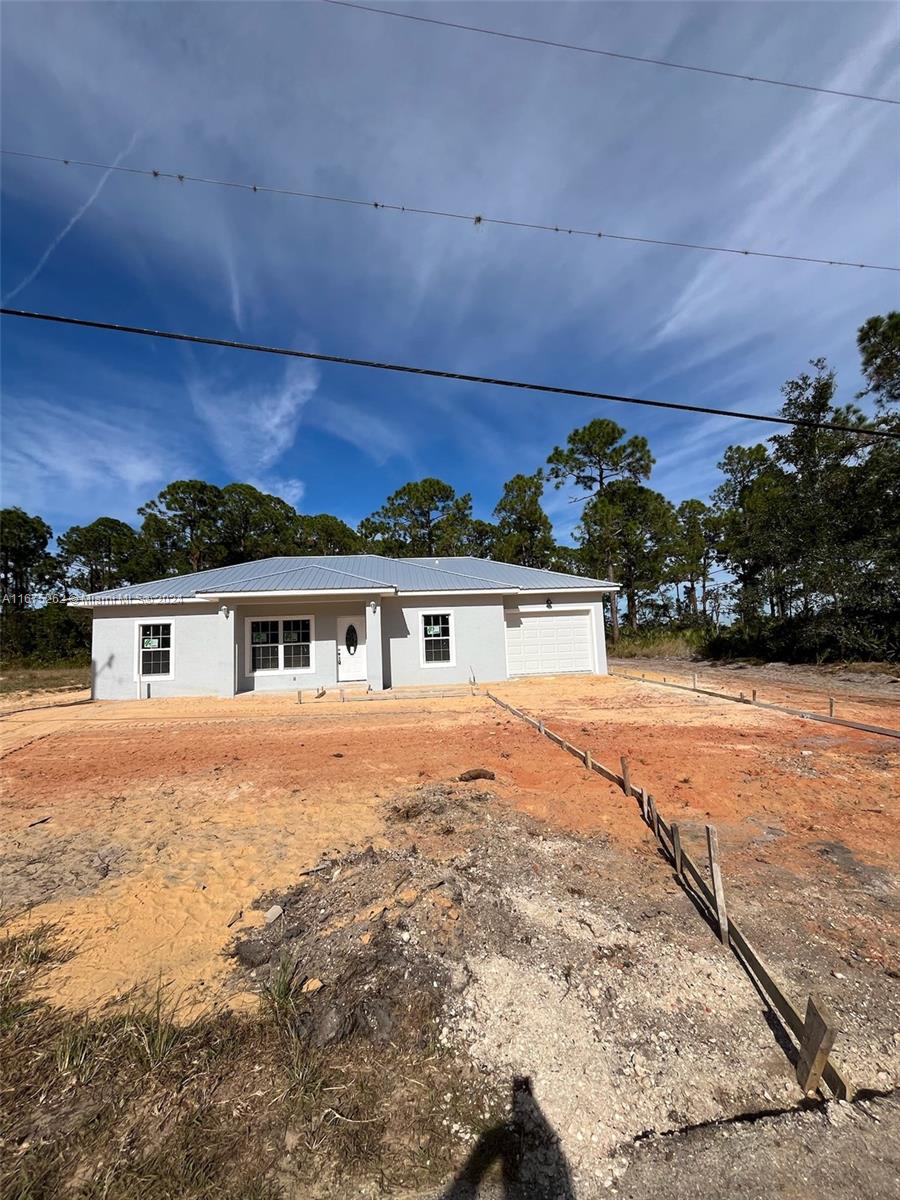 a view of a yard in front of a house with a yard