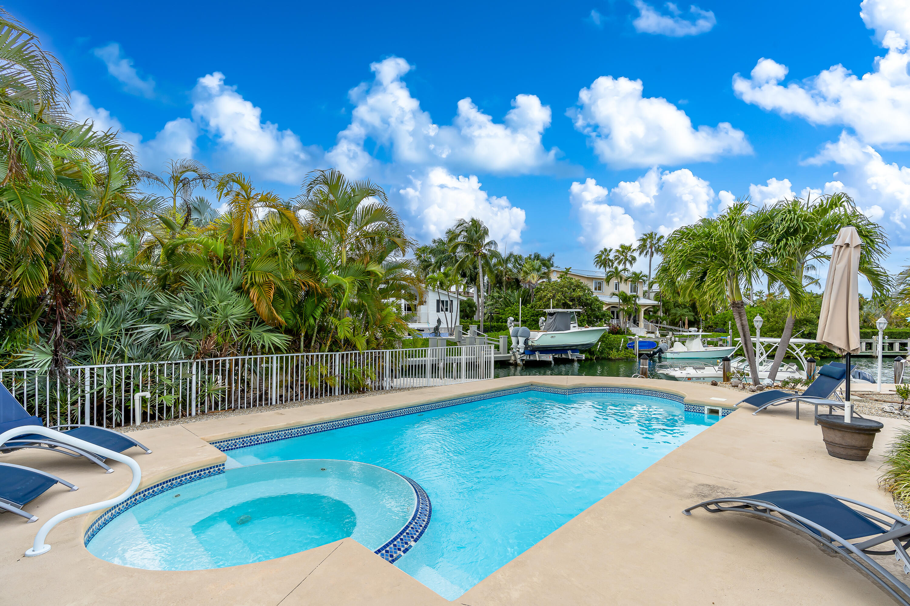 a view of a swimming pool with lounge chairs