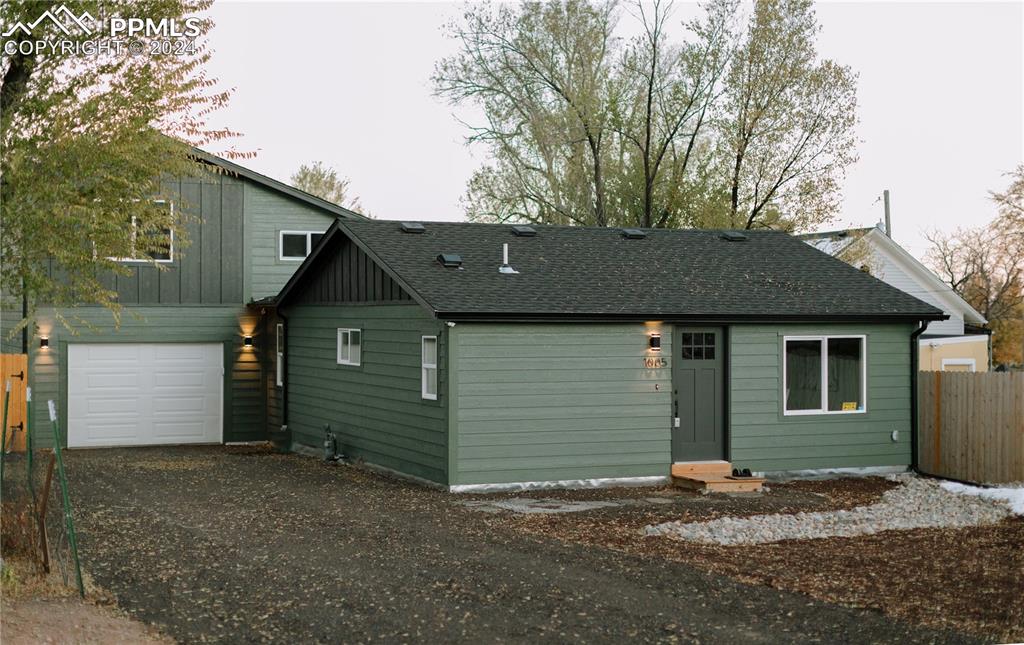 View of front of home featuring a garage