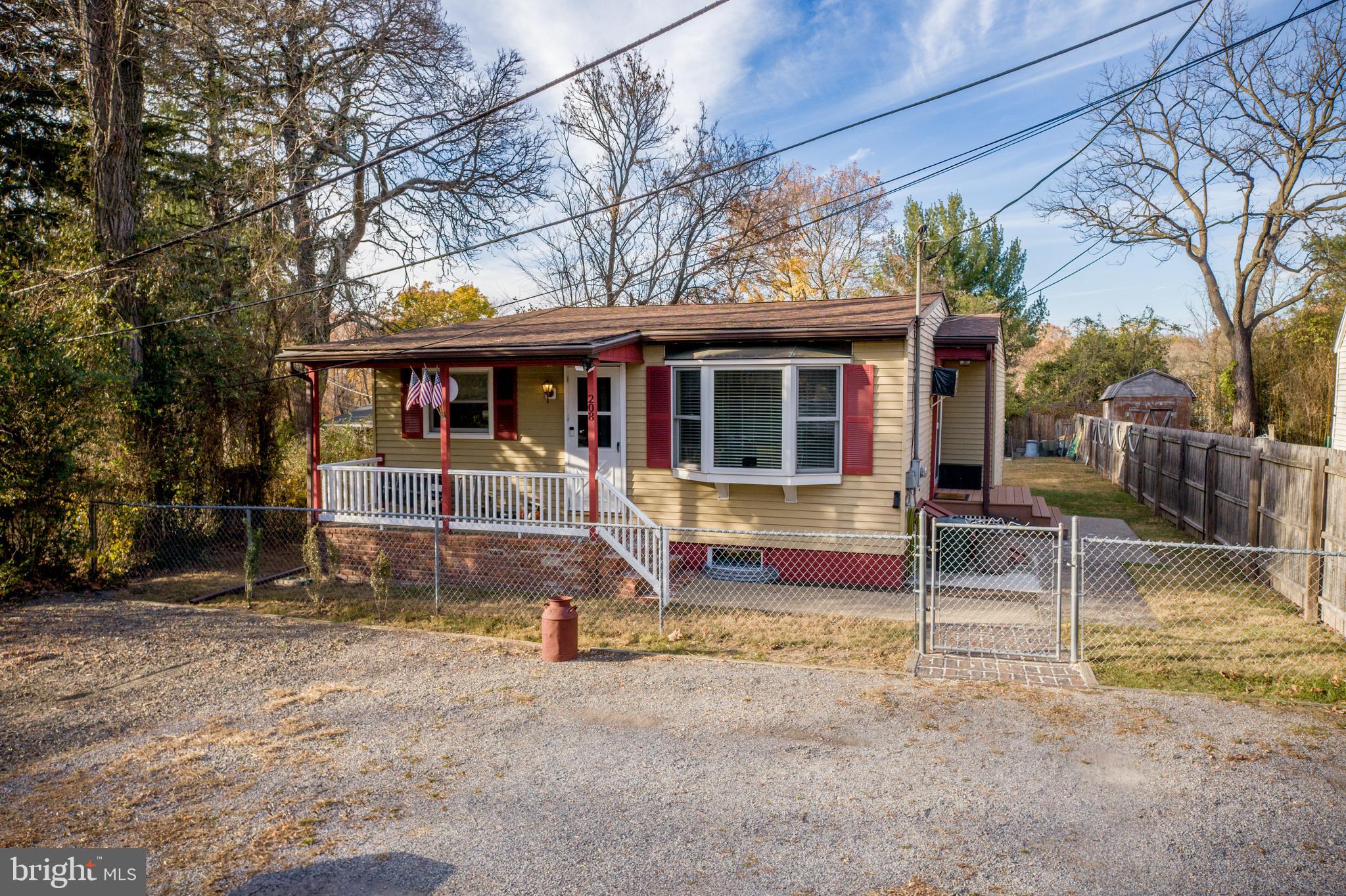 a view of house with a yard