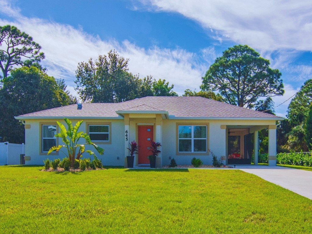 front view of a house with a yard