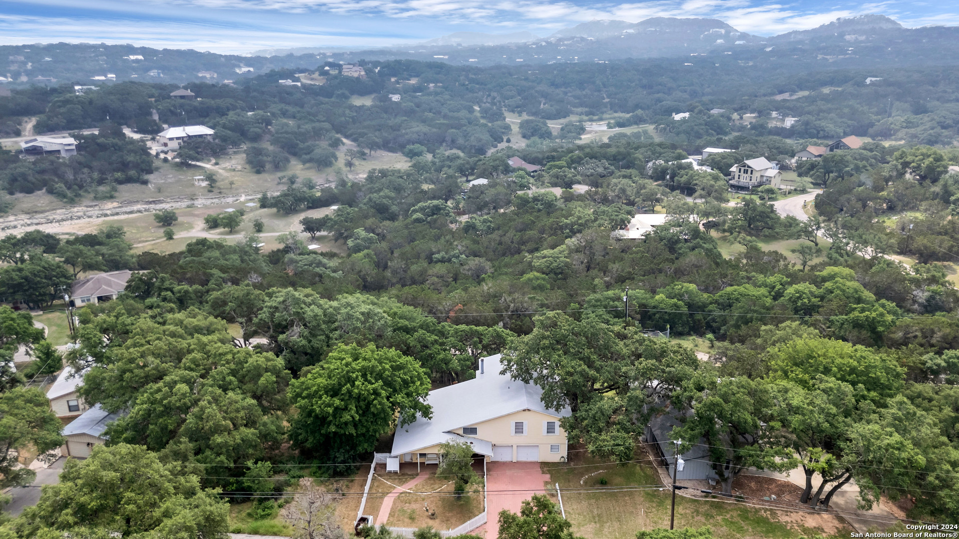 an aerial view of house with yard