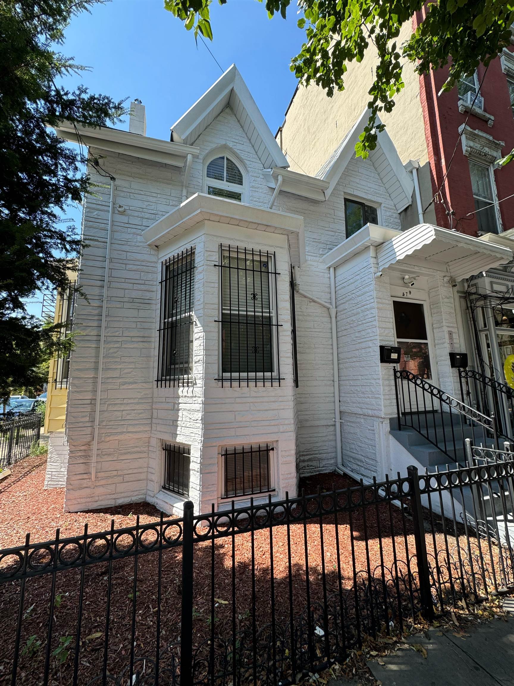 a front view of a house with glass windows