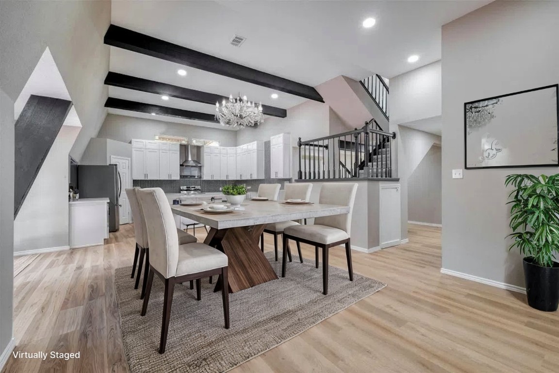 a dining room with furniture and wooden floor