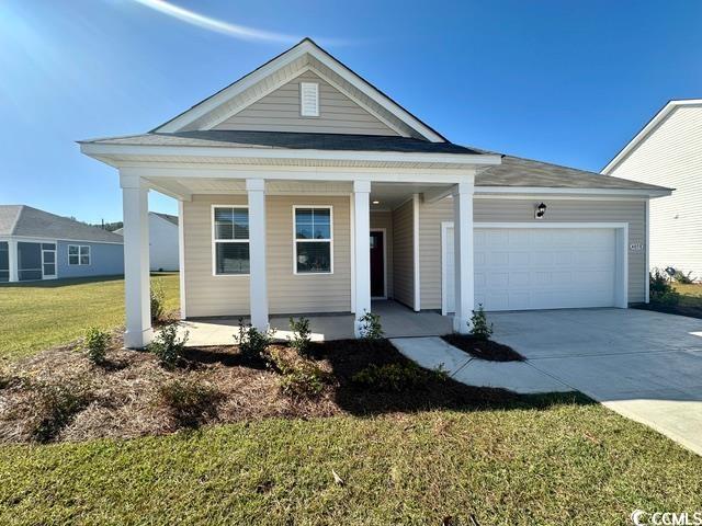 View of front of property with covered porch, a ga